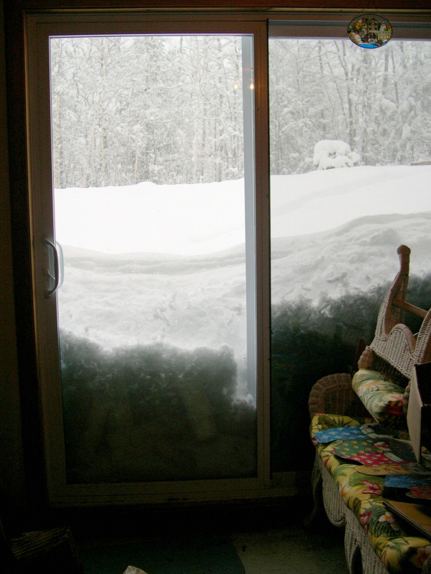 high snow piled up looking outside