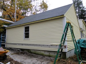 new yellow siding on garage