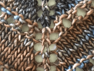 increase holes down center of shawl with yarn over stitches.