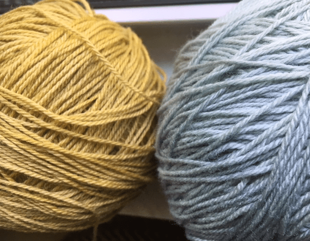 yellow and blue balls of yarn