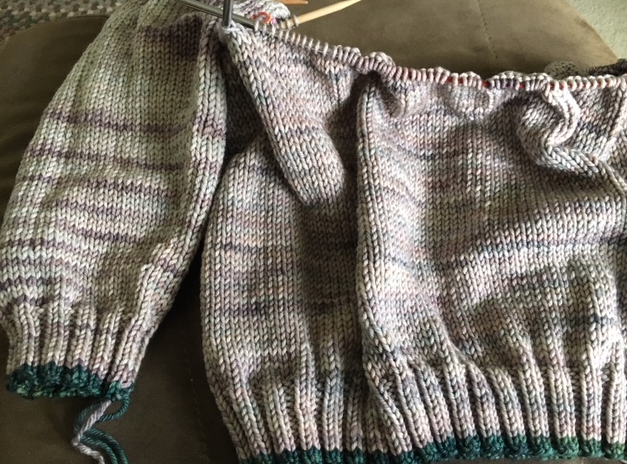One sleeve and body of the Umpqua sweater pattern using Malabrigo Rios yarn in color "whole grain".