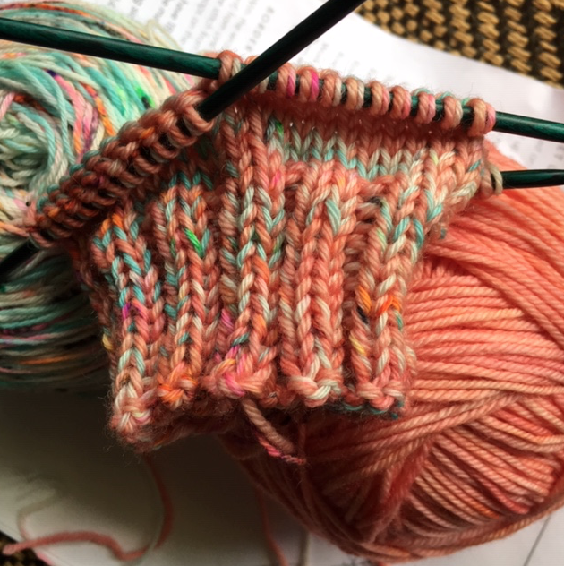 Peach and aqua sock knitting