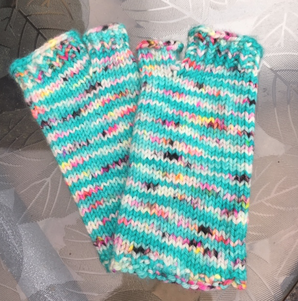 Flip flop socks in aqua blue variegated yarn with open toes and no heel.