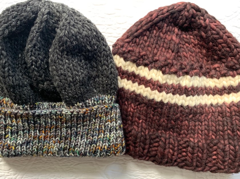 two hand-knit winter hats
