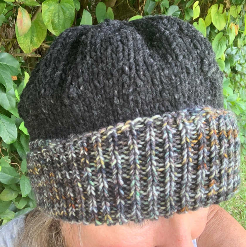 Hand-knit winter hat with roll brim