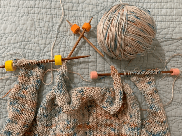 Top edges of sweater on hold