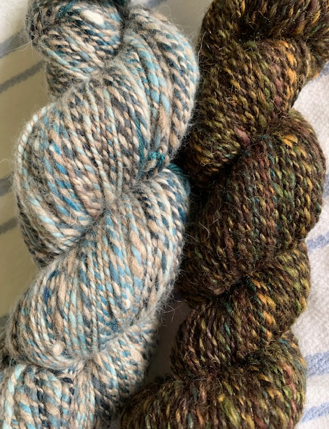 two skeins of hand-spun yarn