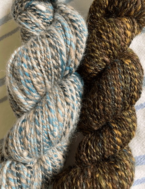 two skeins of hand-spun yarn