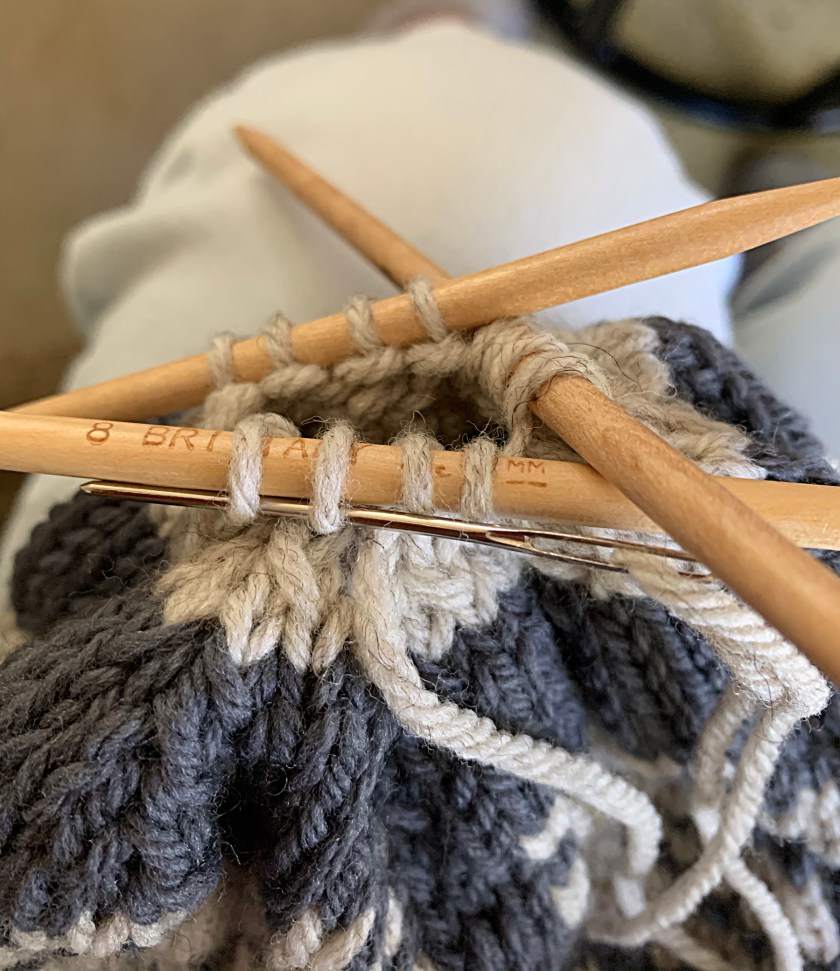 Crown finishing with darning needle picking up stitches