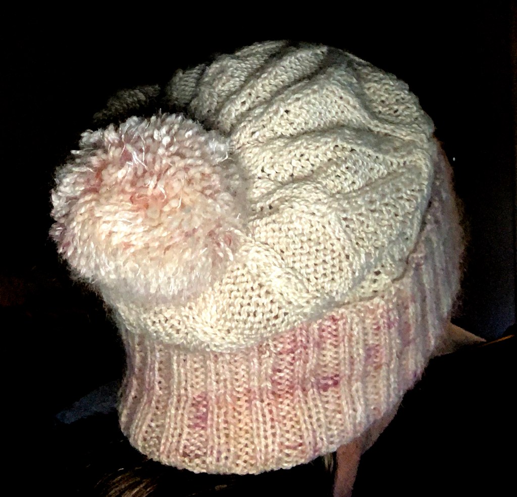 White and pink Skiff Watch cap on my head