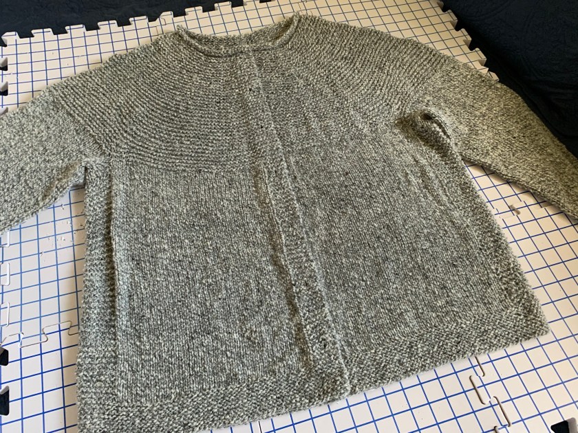 Cobblestone Cardigan knitting project on the mats and drying