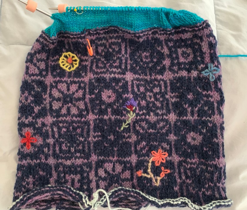 Knitting a blue lining and doing embroidery on Keramos Cowl