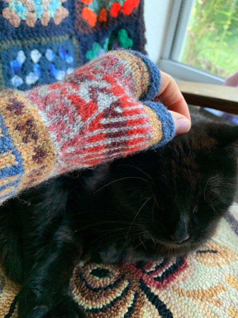 Colorwork mitt wearing thumb stitches