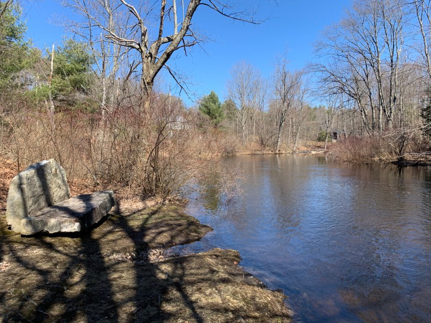 granite seat next to Nubanusit Brook