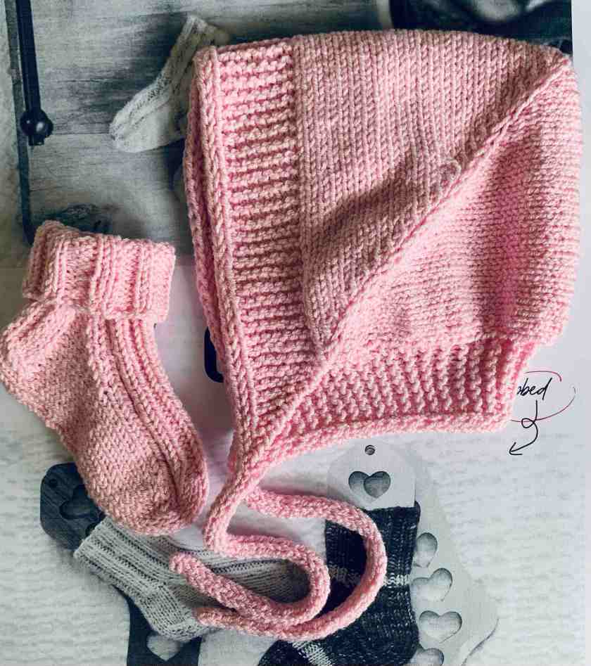 Beloved baby bonnet and little pink socks