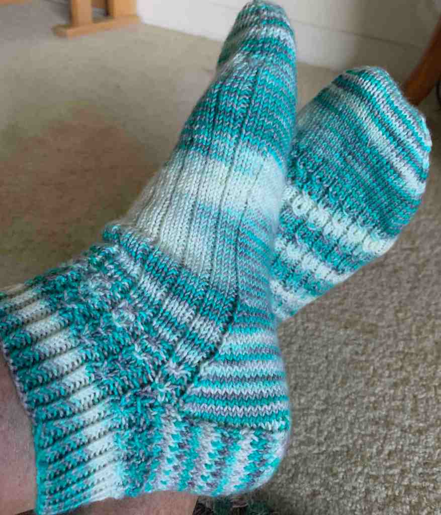 hand knit socks in aqua blue variegated yarn