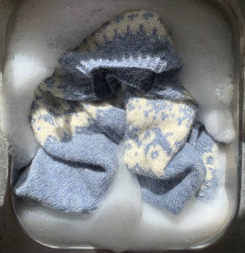 sink washing hand-knit sweater