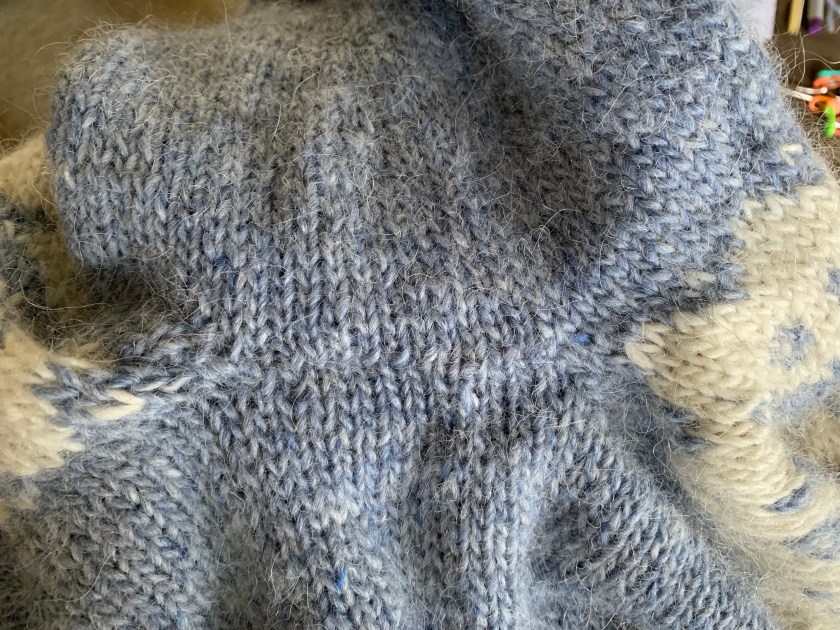 Seam done to close hole at underarm