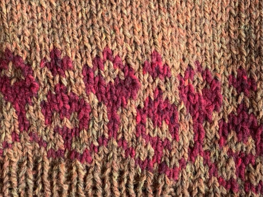 flower colorwork at bottom of body