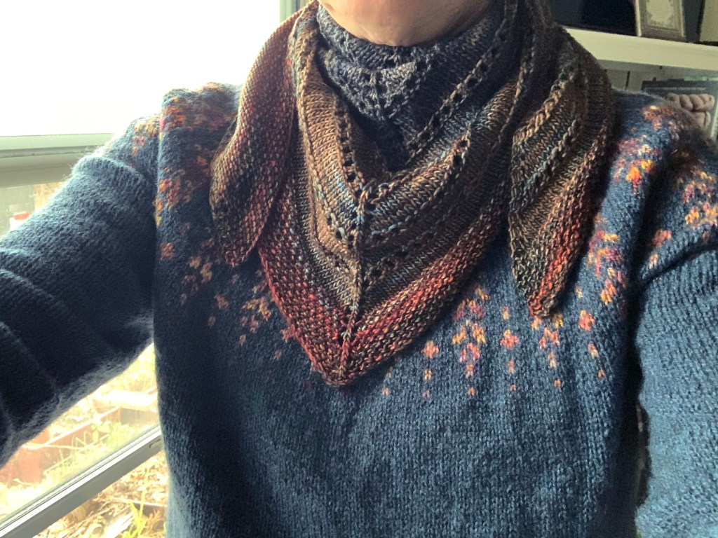 wearing hand knit sweater and shawl