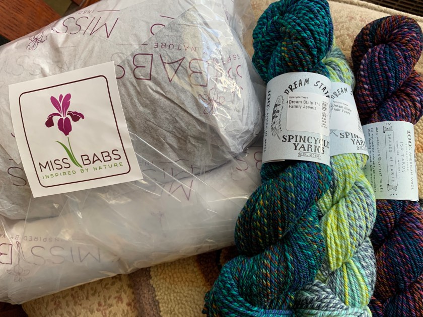 Wrapped Miss Babs yarn delivered and Spincycle skeins