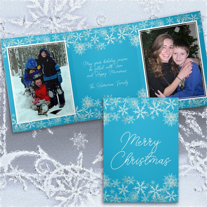 Blue snowflakes Christmas photo card folded twice with two photo templates.