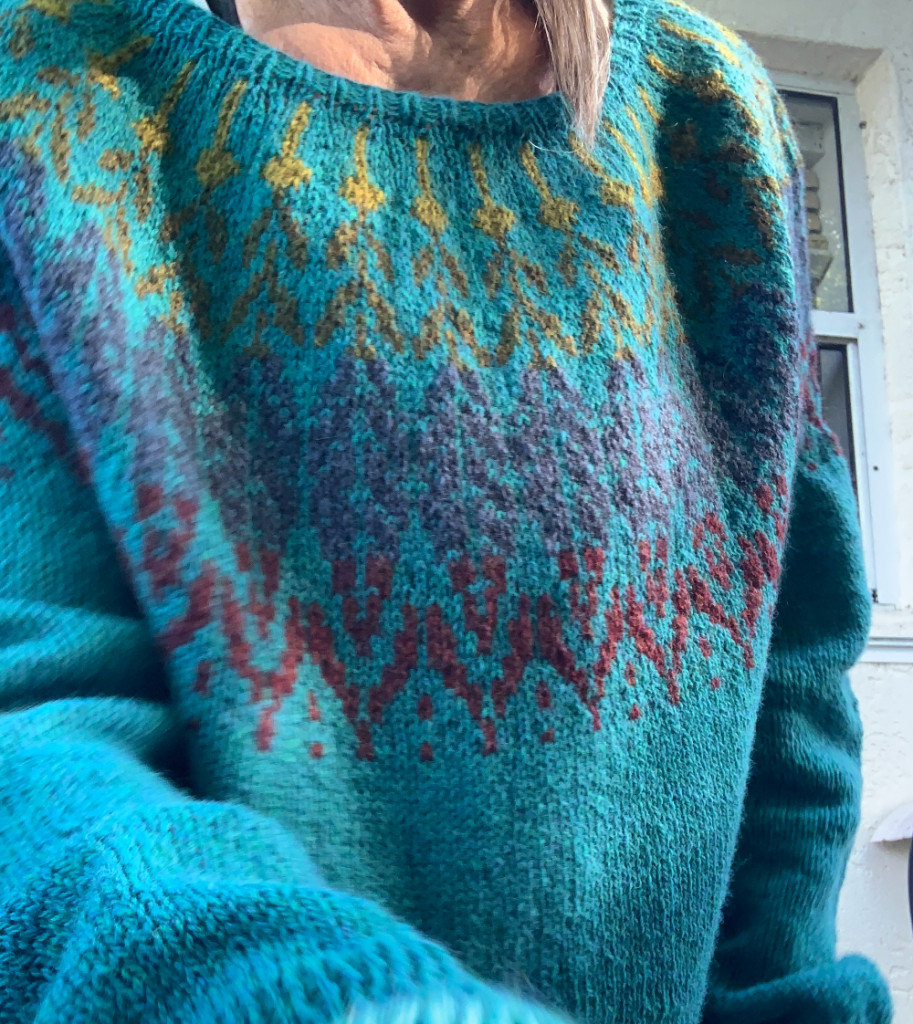 The Solvi sweater knitting pattern shown on me.