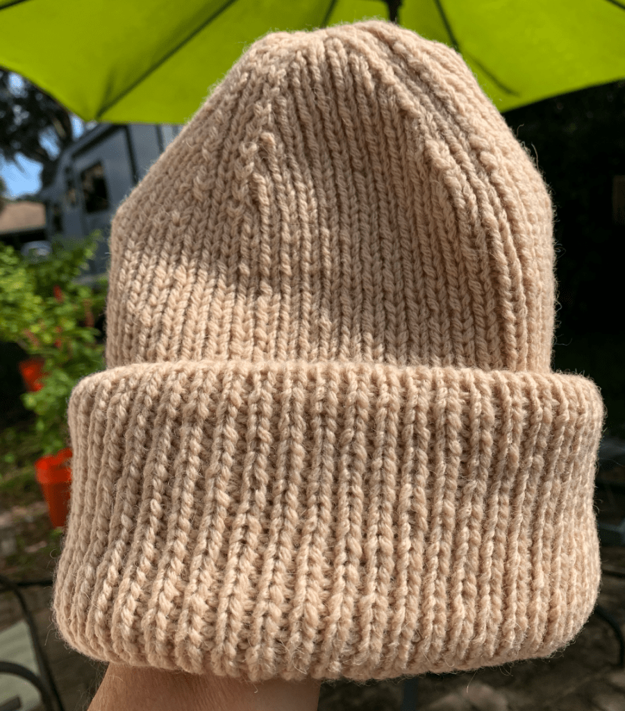 Weekend hat knit using camel hair yarn in a natural beige color.