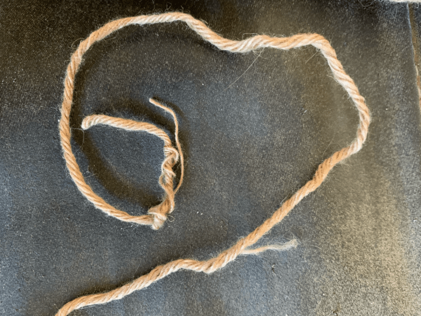 Camel yarn strand with thread broken