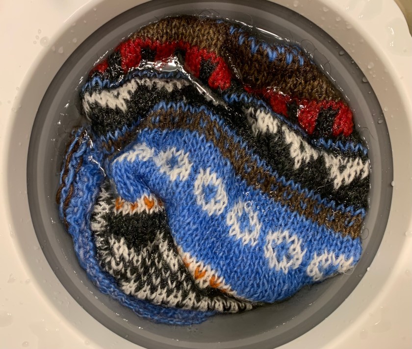 Knitting project soaking in clear water
