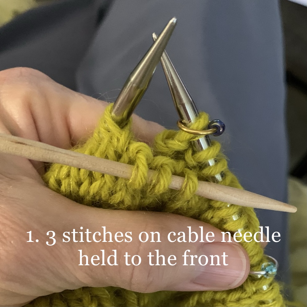 knitting a cable holding three stitches to the front