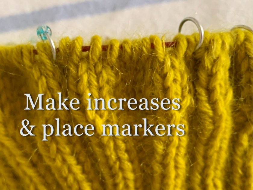 Maine Cables Hat knitting with cable sections marked with stitch markers