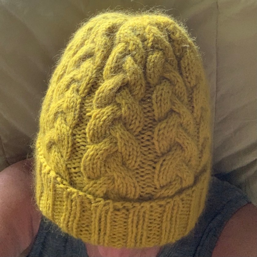 wearing the Maine Cables Hat in umami yellow wool yarn - Knitting for Olive merino and mohair.