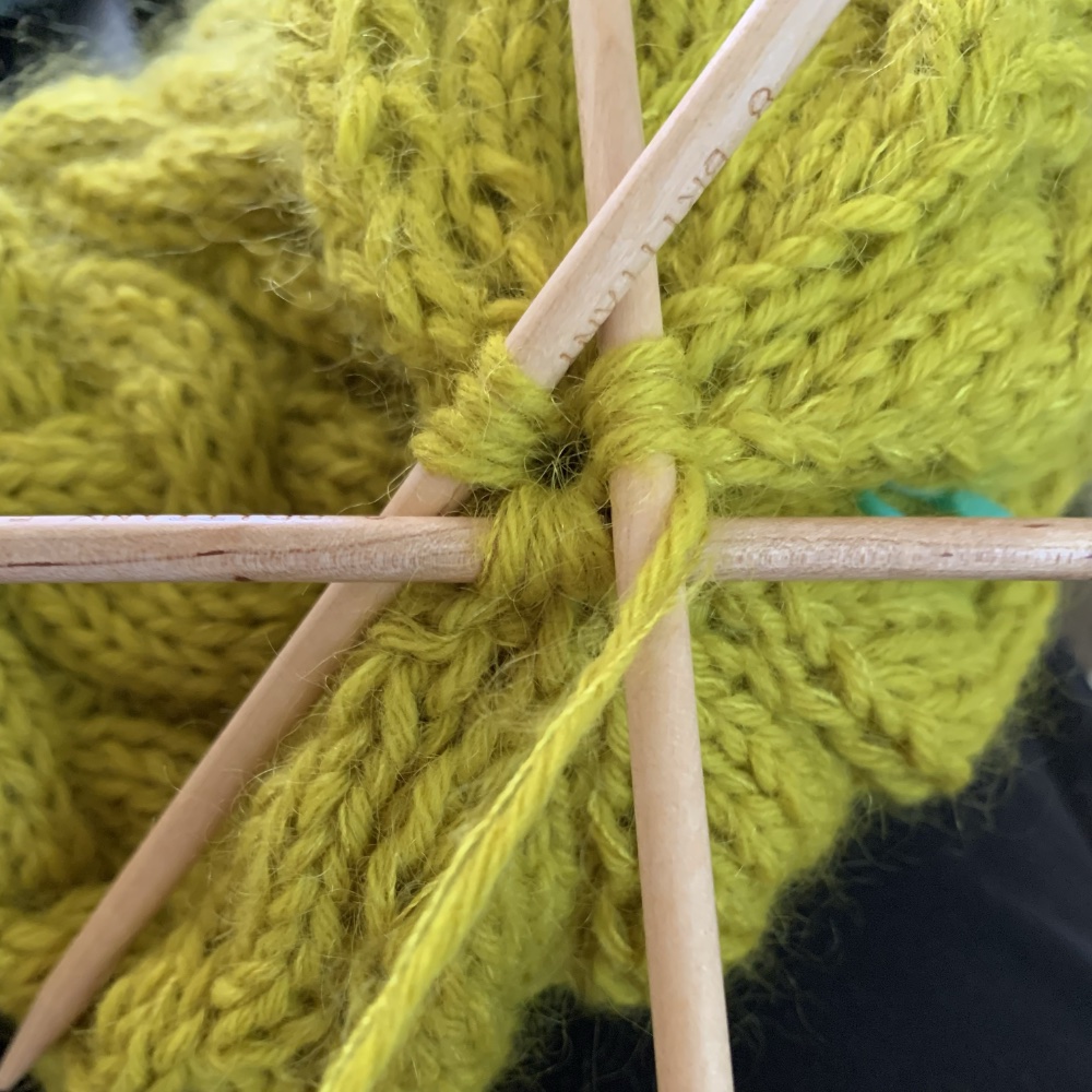 Last stitches on three needles at the crown
