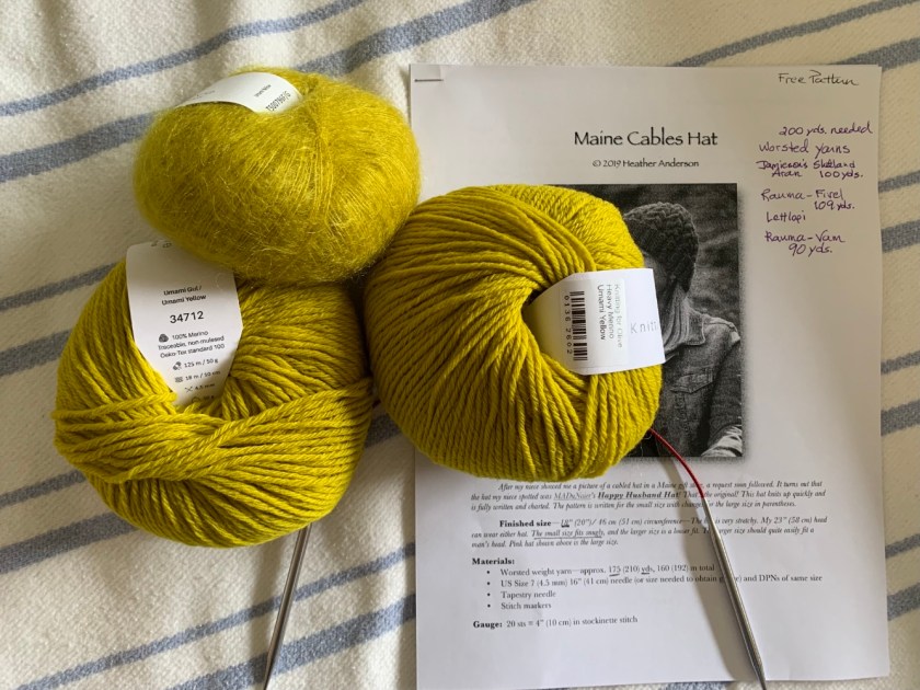 Maine Cables Hat knitting pattern and yellow yarn